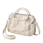 EYE Archive Astra Bag in cream, three-quarter view with detachable crossbody strap