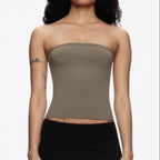 Front view of the olive Tube Top worn with a black skirt