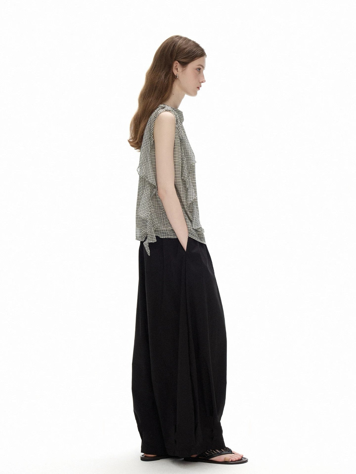 Side profile of the Cascade Top showing the loose cut and the gently curved hem