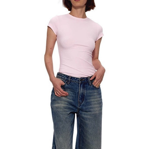 The Essential Tee in pale pink worn with wide blue jeans