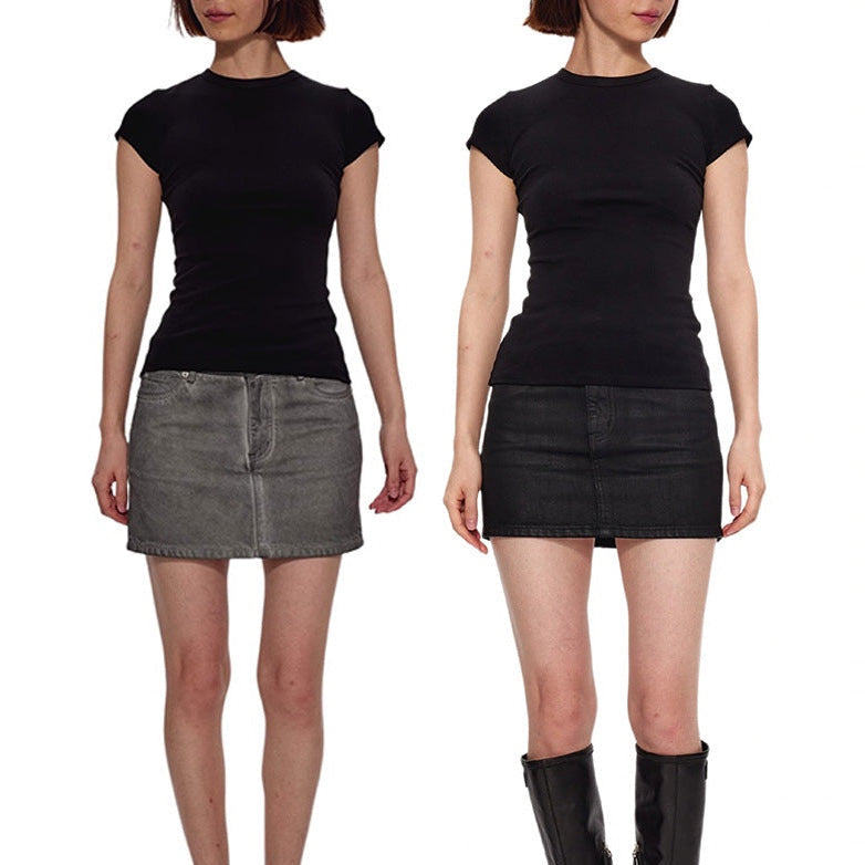 The black Essential Tee worn with a grey denim mini skirt