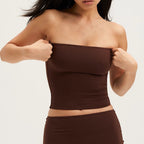 Front view of the brown Tube Top worn with a matching brown skirt