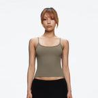 Front view of the Studio Tank in taupe, worn with a black skirt