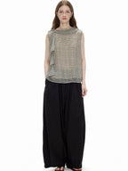 Full-length front view of the Cascade Top styled with black wide-leg trousers