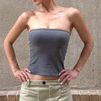 The grey Tube Top worn outdoors with a pale utility skirt