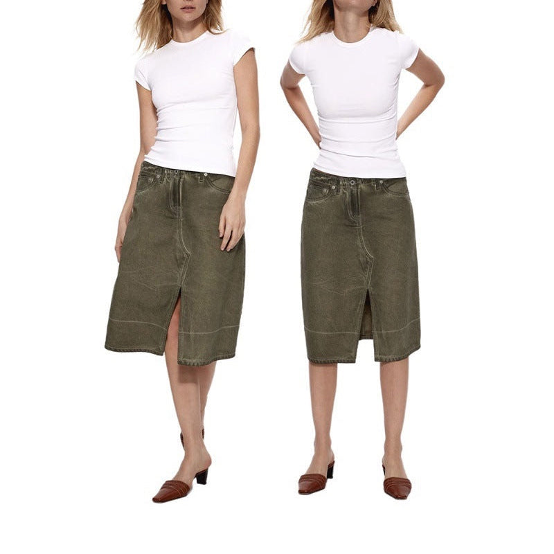 The white Essential Tee worn with an olive midi skirt