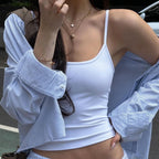 The white Studio Tank layered under an open blue striped shirt