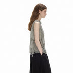 Side profile of the Cascade Top showing the loose cut and the gently curved hem