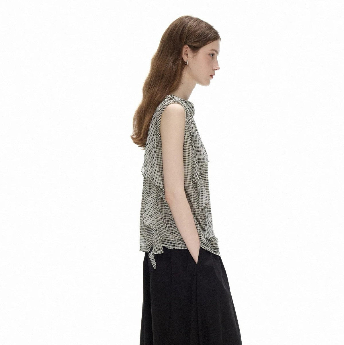 Side profile of the Cascade Top showing the loose cut and the gently curved hem