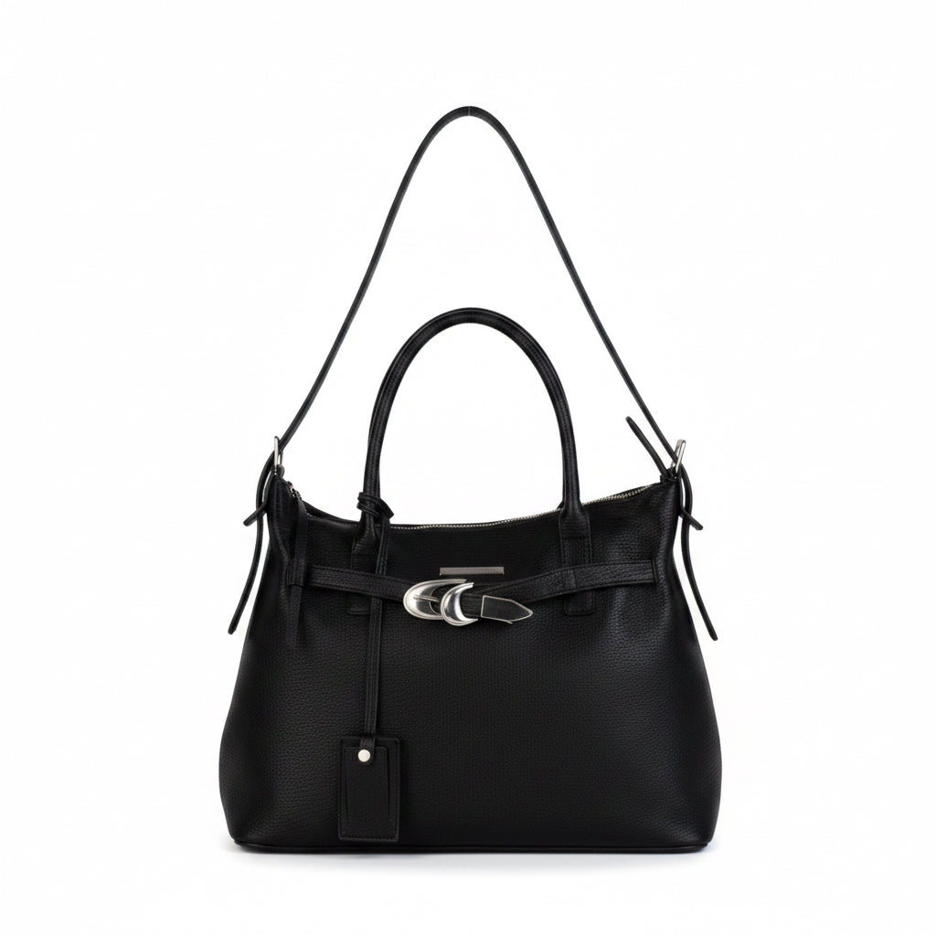 The Signature Tote carried on the shoulder strap